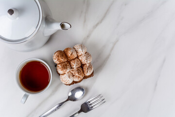 Mini chocolate cake with a cup of tea.