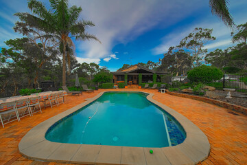 Residential house in Dural a country suburb in Sydney NSW Australia with lush green trees and grass 