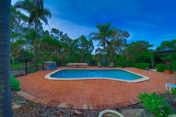 Residential house in Dural a country suburb in Sydney NSW Australia with lush green trees and grass 