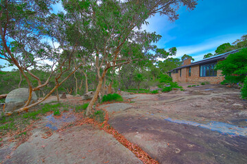 Residential house in Dural a country suburb in Sydney NSW Australia with lush green trees and grass 