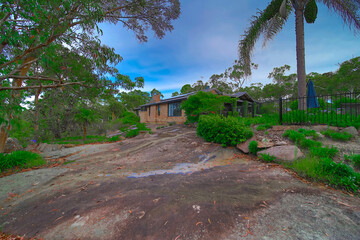 Residential house in Dural a country suburb in Sydney NSW Australia with lush green trees and grass 