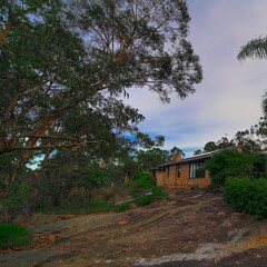 Residential house in Dural a country suburb in Sydney NSW Australia with lush green trees and grass 