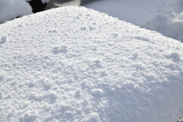 Close up of fresh snow on the cafe table observation deck at peak Mansfield summit - Stowe Mountain Ski resort, VT