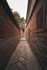 Obraz premium Traditional red brick buildings and narrow alleys with South Fujian building style, famous travel destination Wudian City in Quanzhou, China