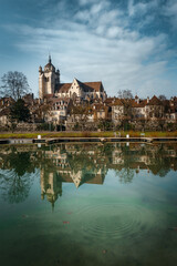 Traditional French medieval town, Dole town and cathedral with river in foreground - obrazy, fototapety, plakaty