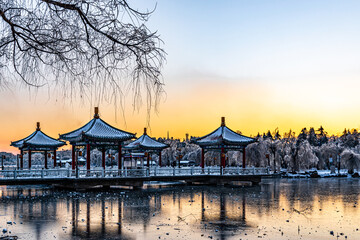Fototapeta premium Winter landscape of Nanhu Park in Changchun, China after heavy snowfall