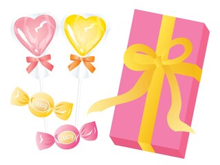 ピンクや黄色のハートのキャンディーとリボンつきの箱のセット