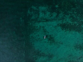 A couple floating with a standup paddleboard in Lake Constance Bodensee near Altnau Thurgau...