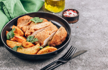 Homemade breaded chicken stuffed with cheese and potatoes