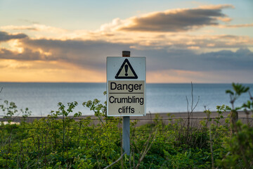 Sign: Danger, crumbling cliffs, seen in Hunstanton, Norfolk, England, UK