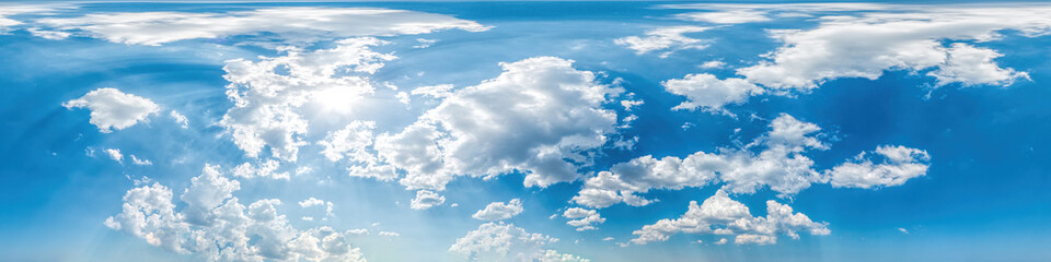 Blue sky with puffy Cumulus clouds Seamless panorama in spherical equirectangular format with...