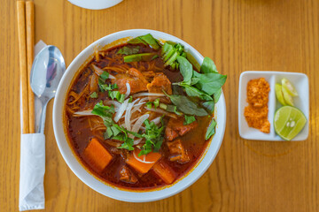 Bowl of tasty Bo Kho - Vietnamese stewed beef rice noodle