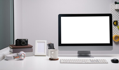 Modern workspace with computer  with blank screen and equipment on white table.Blank screen for your information.