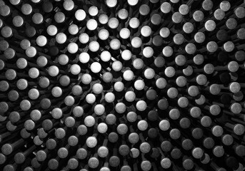 Steel metallic black chrome and silver nail background. Industry technology and structure concept. Texture and abstract backdrop for advertising banner. Top view nails head. 3D illustration rendering