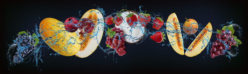 Panorama with fruits in water - juicy grapes, melon, pomegranate, strawberries, coconut, pear...