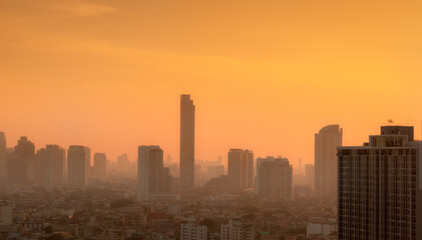 Air pollution in Bangkok, Thailand. Smog and fine dust of pm2.5 covered city in the morning with...
