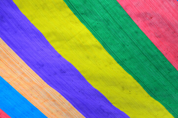 Plastic tent consists of pink, green, blue, yellow and orange colors.