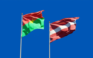 Flags of Latvia and Burkina Faso.