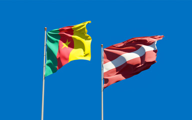 Flags of Latvia and Cameroon.