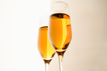 Two glasses of champagne, wine on a gray background. Alcoholic drink: champagne, beer, white wine. New year and Christmas background. Valentine's Day