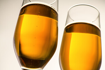 Two glasses of champagne, wine on a gray background. Alcoholic drink: champagne, beer, white wine. New year and Christmas background. Valentine's Day.