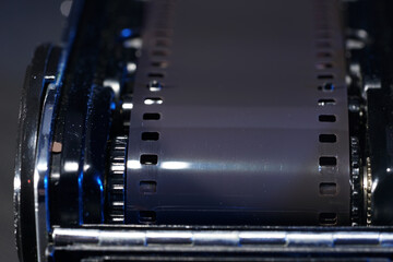 A closeup shot of a roll of a film in an analog camera