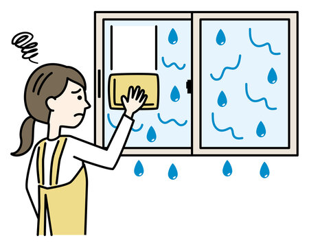 結露で濡れる窓掃除に悩むエプロンの女性