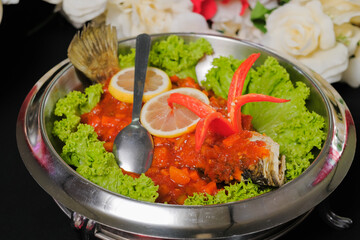 weet sour fried fish on the table  with selective focus and crop fragment