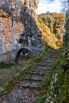 Kokori's old arch stone bridge (Noutsos) during fall season  situated on the river of Voidomatis in  Zagori, Epirus Greece.
