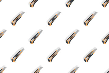 Stationery knives seamless pattern on a white background.