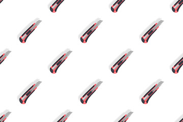 Stationery knives seamless pattern on a white background.