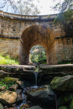 Flowing water under Lennox Bridge, the oldest arch bridge in Australia. © AlexandraDaryl