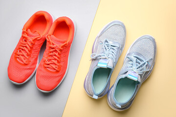 Fototapeta na wymiar Female sportive shoes on color background