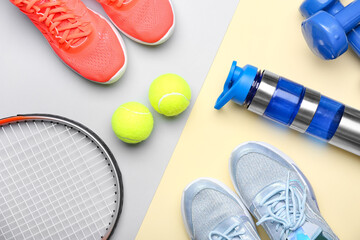 Sportive shoes and tennis balls on color background