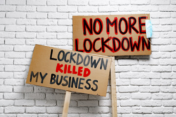 Fototapeta na wymiar Protestive placard against coronavirus lockdowns close up