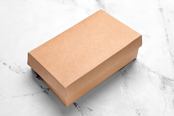 Blank cardboard box on light background