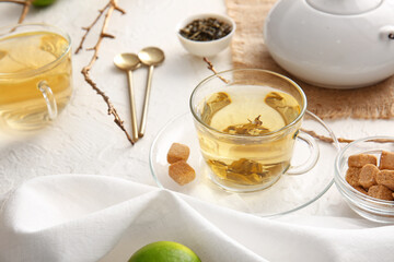 Obraz na płótnie Canvas Composition with cups of green tea on table