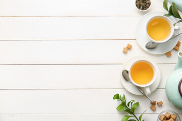 Obraz na płótnie Canvas Cups of green tea on table