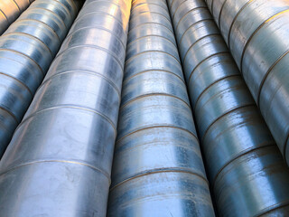 Halvanized ventilation pipe elbows. Industrial metal pipes