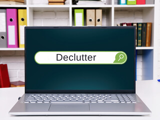 Business concept meaning Declutter  with phrase on the piece of paper.