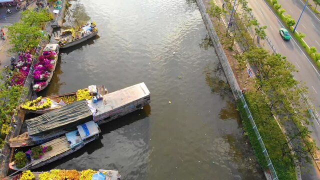 Aerial view of Ben Binh Dong (Binh Dong harbour) in lunar new year ( Tet Festical in Vietnam) with flower boats along side the river.