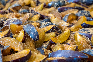 Sweet plum jam with sugar syrup is cooking