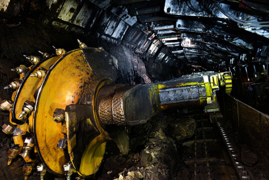 Longwall Mining: Shearer, with two rotating cutting drums and movable hydraulic powered roof supports called shields