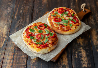 Italian focaccia or pizza with mozzarella, tomatoes and basil. Healthy eating. Vegetarian food.