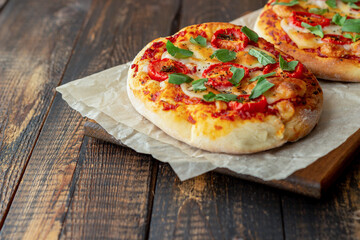 Italian focaccia or pizza with mozzarella, tomatoes and basil. Healthy eating. Vegetarian food.