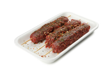 Plastic box with raw minced meat or lula kebab isolated on white background