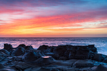 Obraz na płótnie Canvas High Cloud Sunrise Seascape from Rock Platform