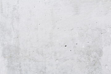 Gray concrete wall peeled of wallpaper. Concrete background.