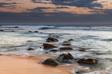 Sunset, rocks and the sea