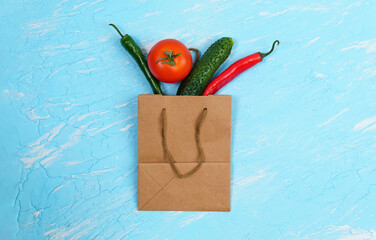 ripe vegetables, in craft paper bag. Zero waste concept. flat lay copyspace